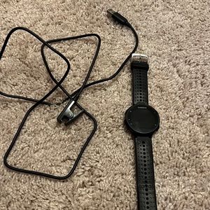 Forerunner 235 used, still has a lot of life. With charging cord